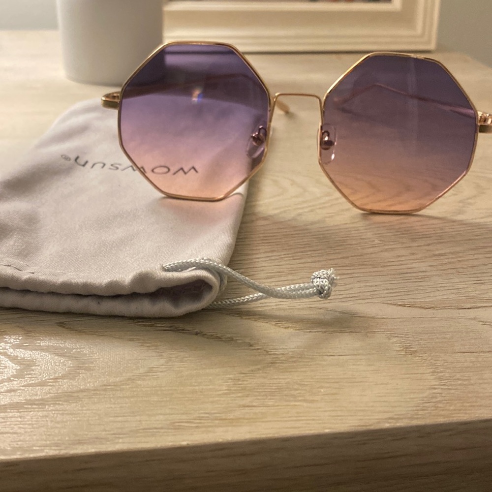 Gold octagonal sunglasses with purple tinted lenses